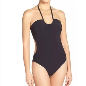 Tory Burch one-piece black bandeau swimsuit.